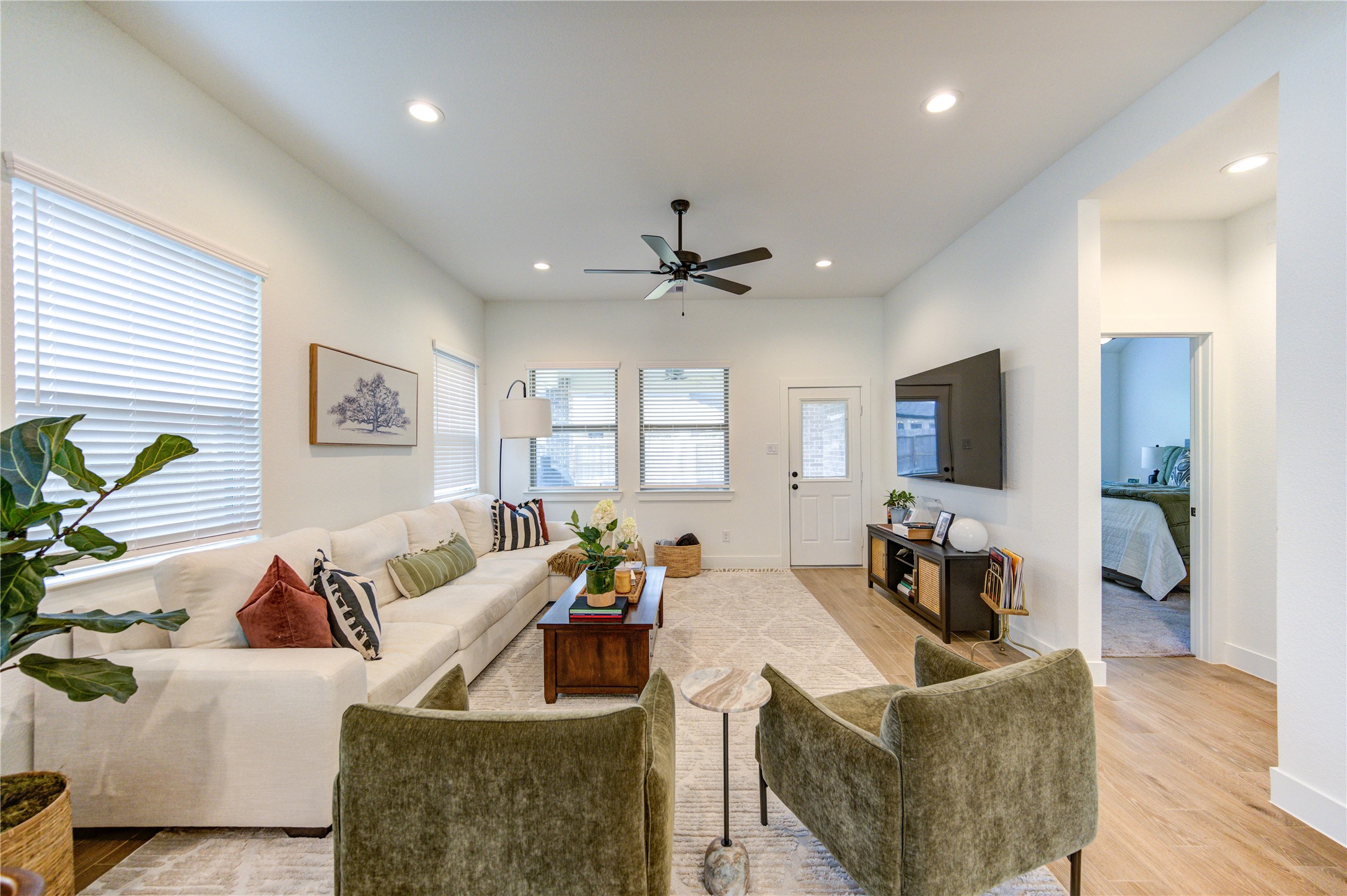 17758 Tree Of Heaven Conroe, TX 77385 - Photo 9 of 44 a living room with furniture and a wooden floor