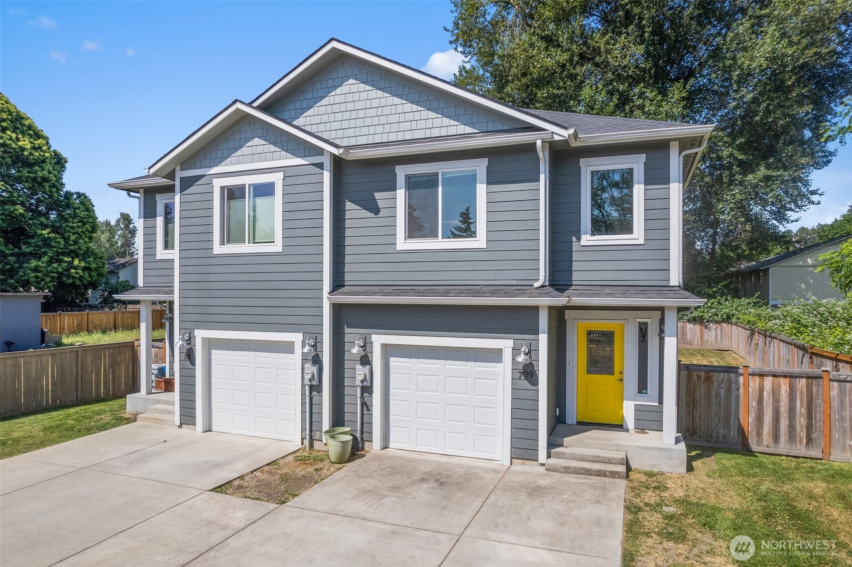 709 3rd Avenue South Kent, WA 98032 - Photo 1 of 26 a front view of a house with a yard and garage