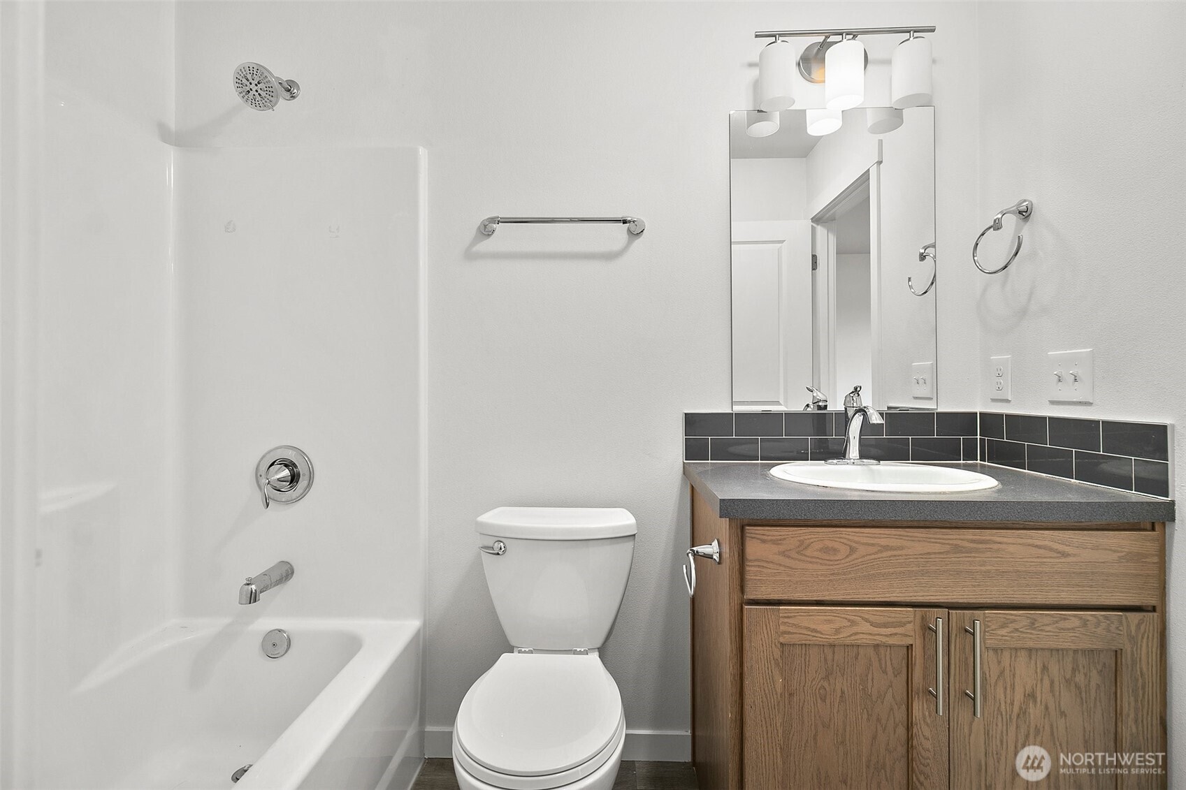 709 3rd Avenue South Kent, WA 98032 - Photo 20 of 26 a bathroom with a granite countertop sink a toilet and shower