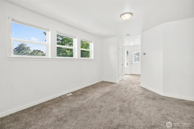 a view of an empty room with stairs