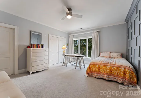 a bedroom with a bed and a table