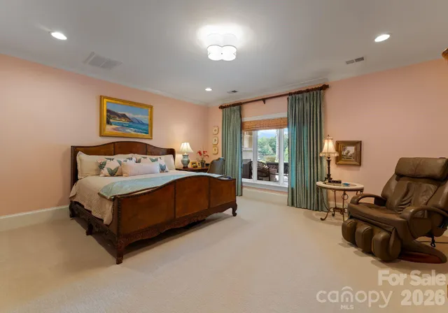 a bedroom with a bed and glass window