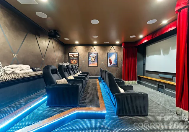 a living room with furniture flat screen tv and gym equipment