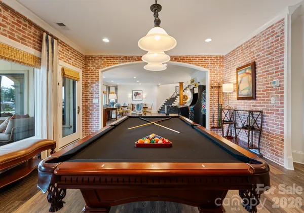 a room with furniture and pool table