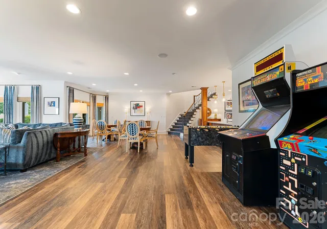 a living room with furniture and wooden floor