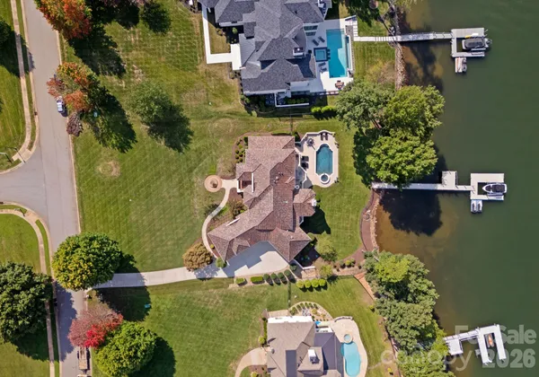an aerial view of residential house with outdoor space and swimming pool