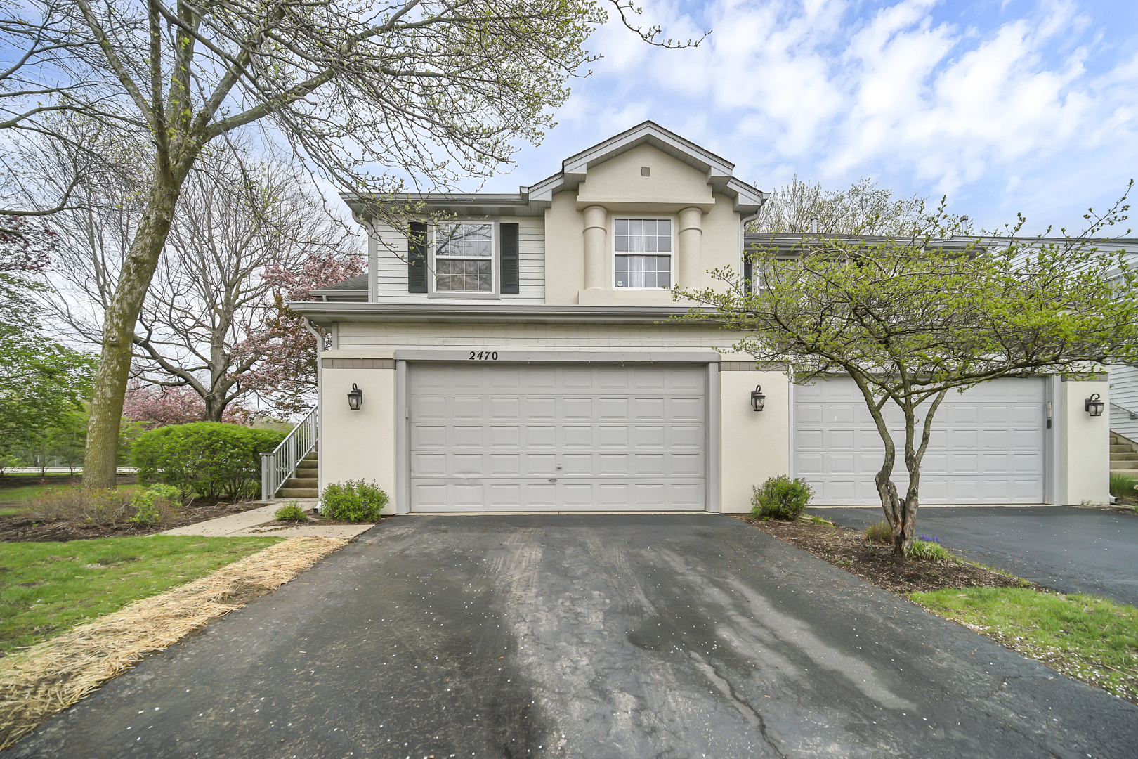2470 Palazzo Court Buffalo Grove, IL 60089 - Photo 1 of 31 a front view of a house with a yard and garage
