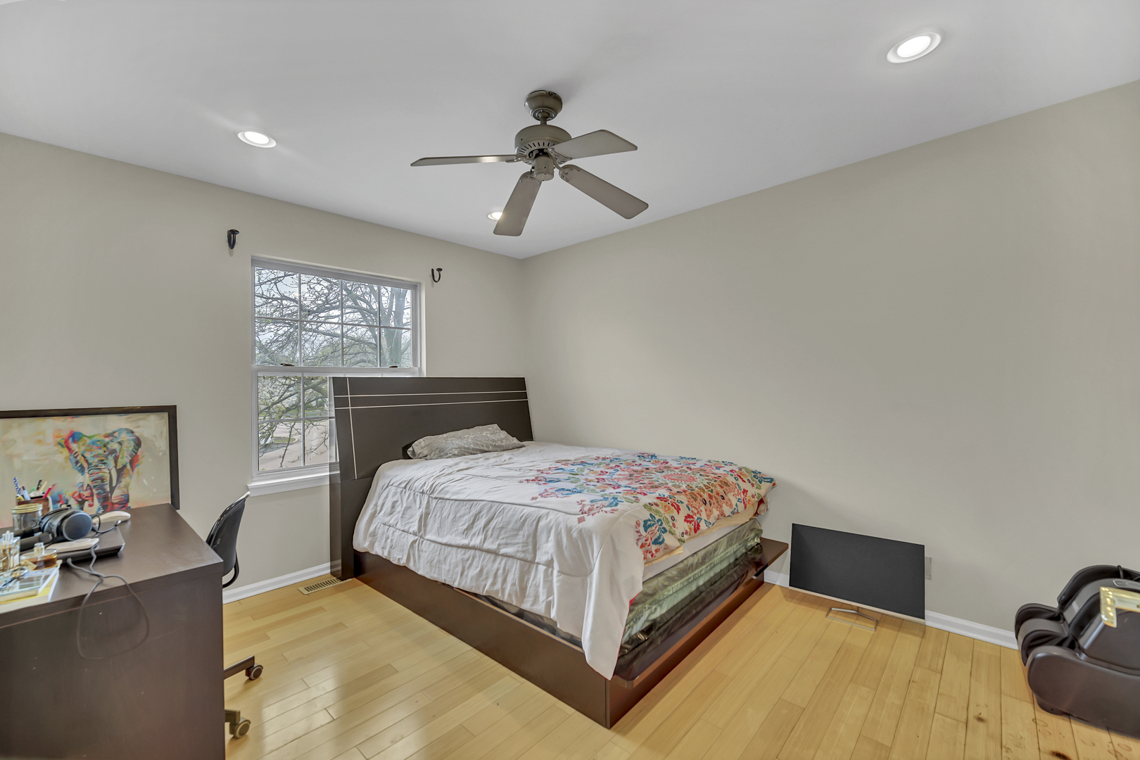 2470 Palazzo Court Buffalo Grove, IL 60089 - Photo 15 of 31 a bedroom with a bed and ceiling fan