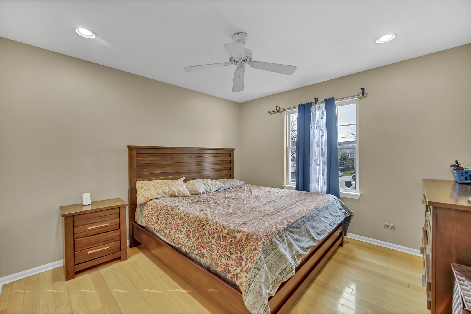 2470 Palazzo Court Buffalo Grove, IL 60089 - Photo 18 of 31 a bedroom with a bed and a chandelier