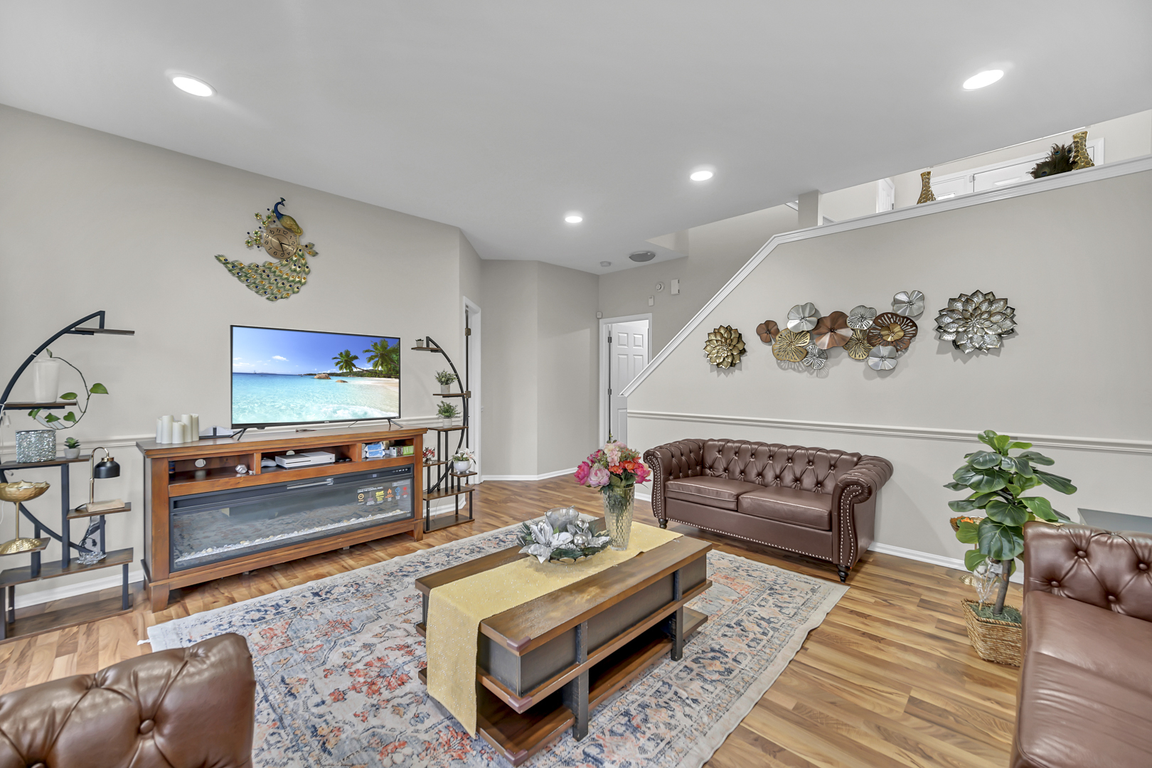2470 Palazzo Court Buffalo Grove, IL 60089 - Photo 19 of 31 a living room with furniture and a flat screen tv