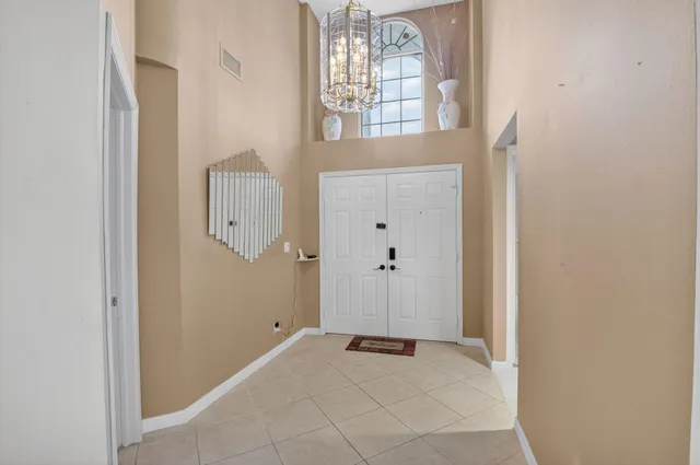 a view of a livingroom with furniture and gym equipment