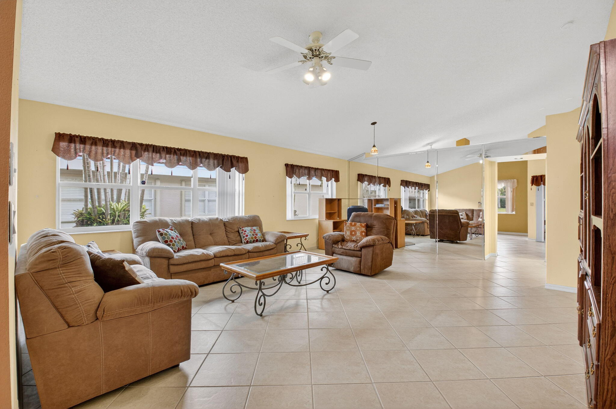 11168 Sangria Court Boca Raton, FL 33498 - Photo 20 of 63 a living room with furniture and a large window