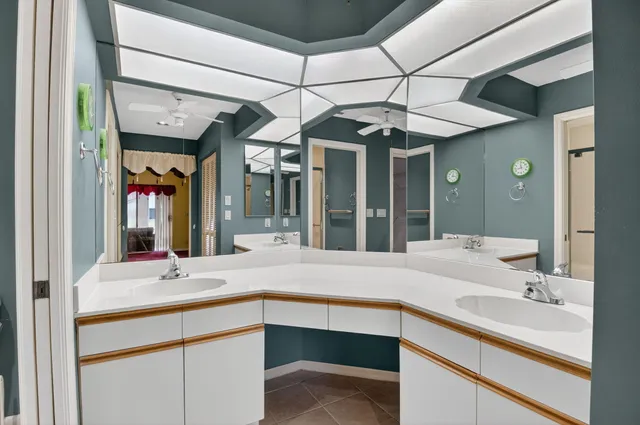 a front view of a house with a garden and plants