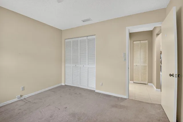a aerial view of a house next to a yard
