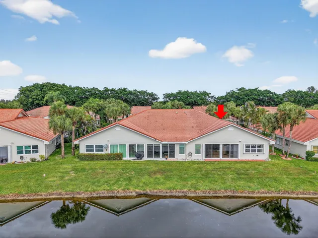 a balcony with wooden floor and lake view