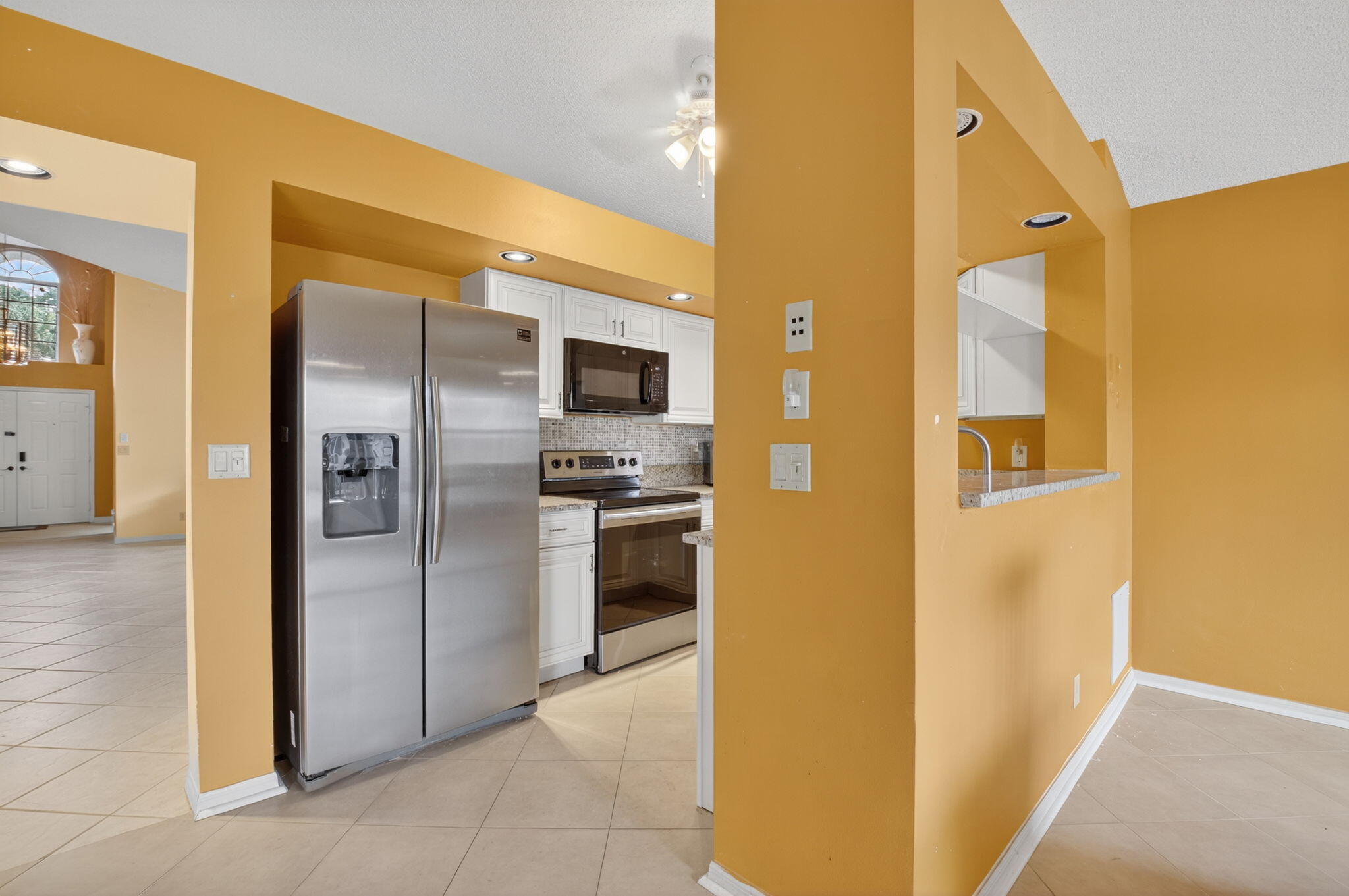 11168 Sangria Court Boca Raton, FL 33498 - Photo 10 of 63 a view of a kitchen from the hallway