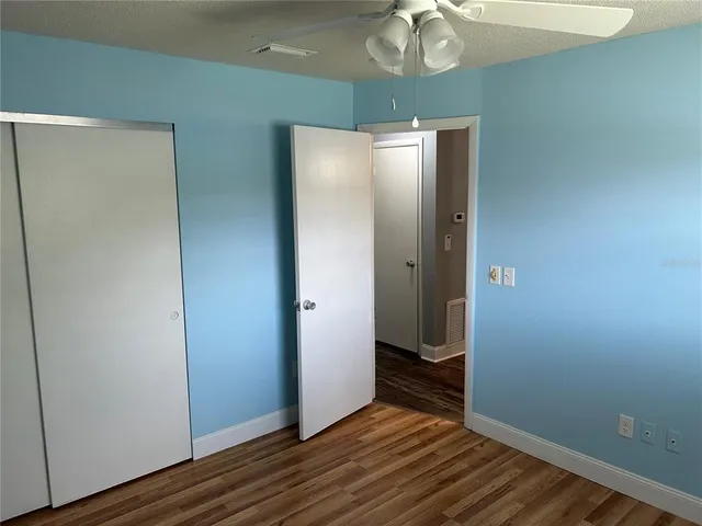 a view of a livingroom with wooden floor