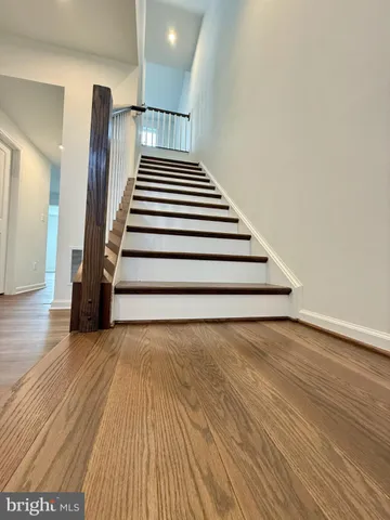 a bathroom with a toilet sink and a mirror