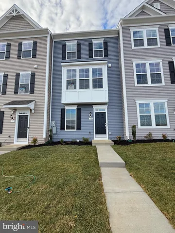 a view of swimming pool is middle in the middle of a yard