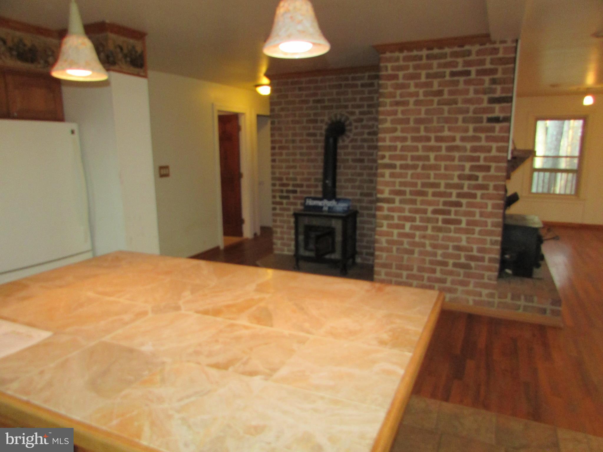 393 Silver Run Valley Road Westminster, MD 21158 - Photo 12 of 30 Kitchen with woodstove