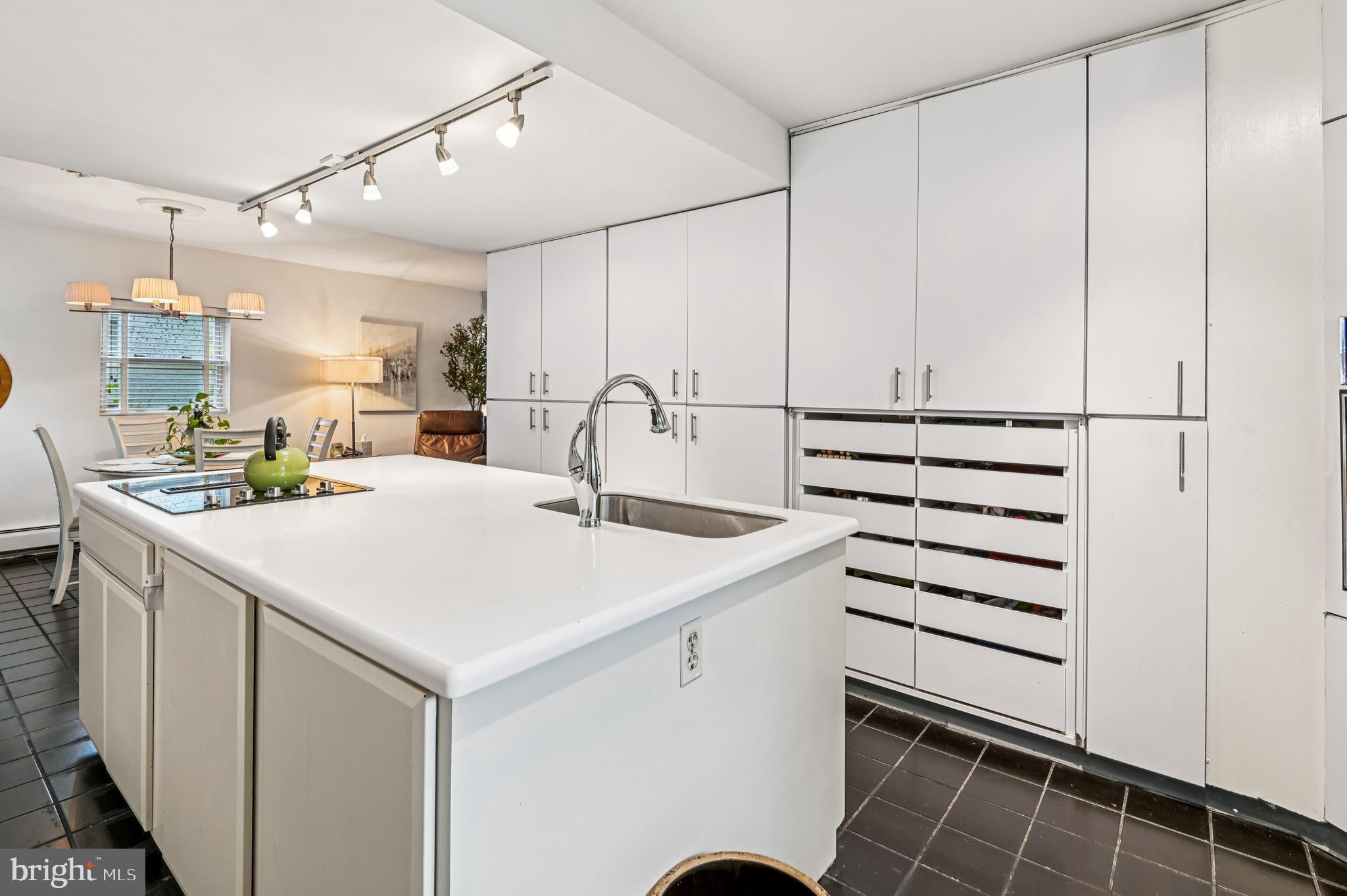 9941 Naylor Avenue Laurel, MD 20723 - Photo 7 of 30 a kitchen with a sink a stove and cabinets