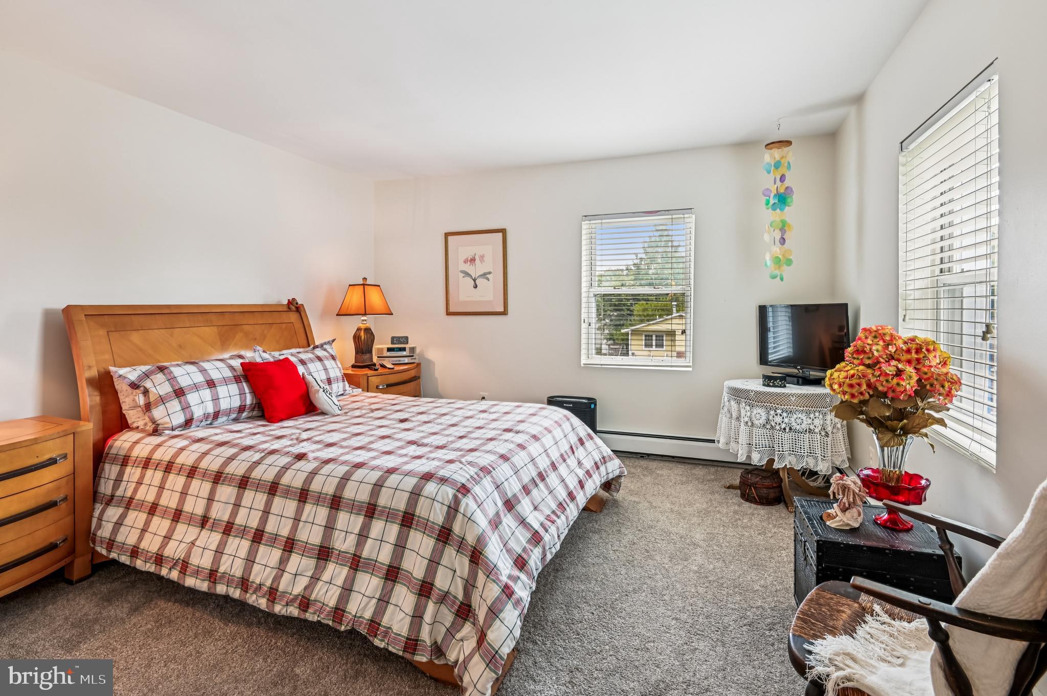 9941 Naylor Avenue Laurel, MD 20723 - Photo 8 of 30 a bedroom with a bed and window