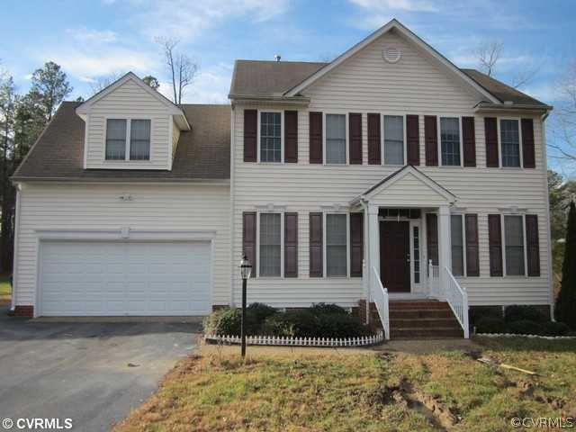 3001 Kinvan Road Henrico, VA 23231 - Photo 1 of 13 a front view of a house with a yard