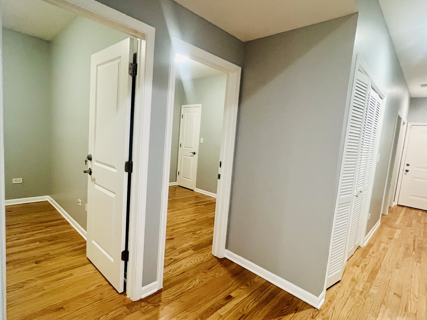 1750 West Cermak Road, Unit B Chicago, IL 60608 - Photo 11 of 18 a view of a hallway with wooden floor and staircase