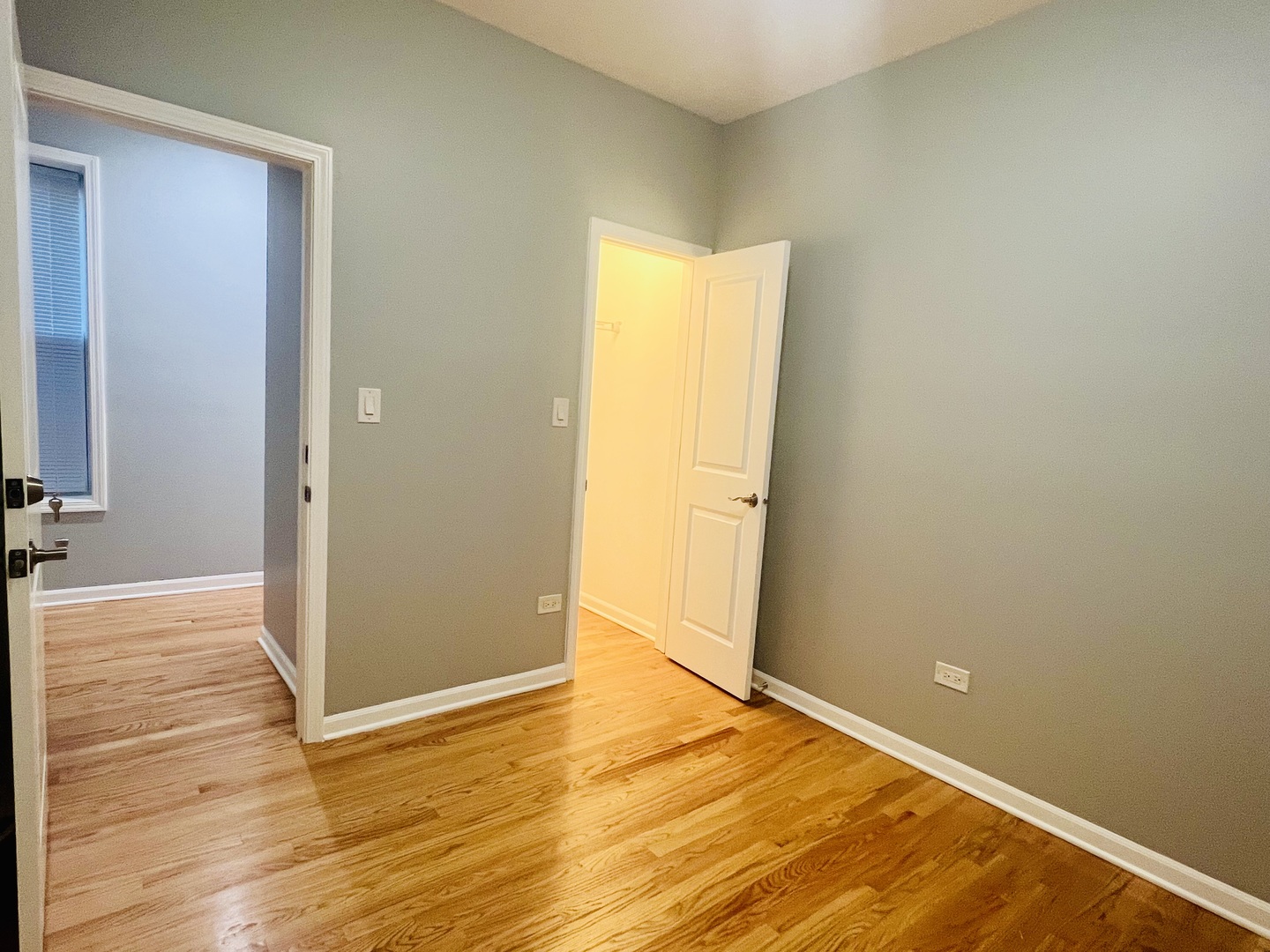 1750 West Cermak Road, Unit B Chicago, IL 60608 - Photo 17 of 18 a view of an empty room with wooden floor