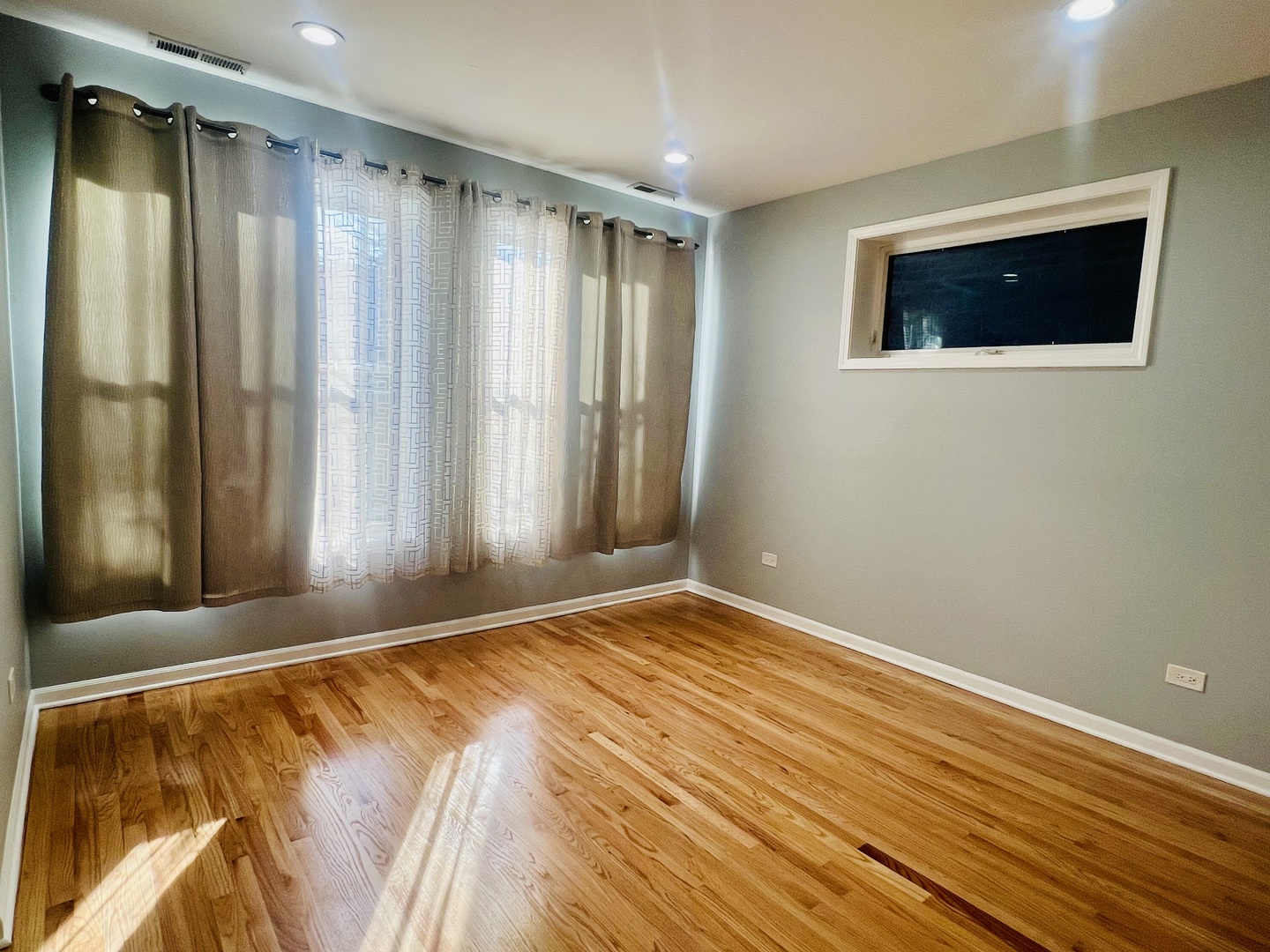 1750 West Cermak Road, Unit B Chicago, IL 60608 - Photo 9 of 18 a view of room with window and hallway