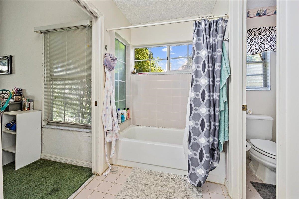 100 North Lake Circle St. Augustine, FL 32084 - Photo 11 of 25 a bathroom with a bathtub and shower