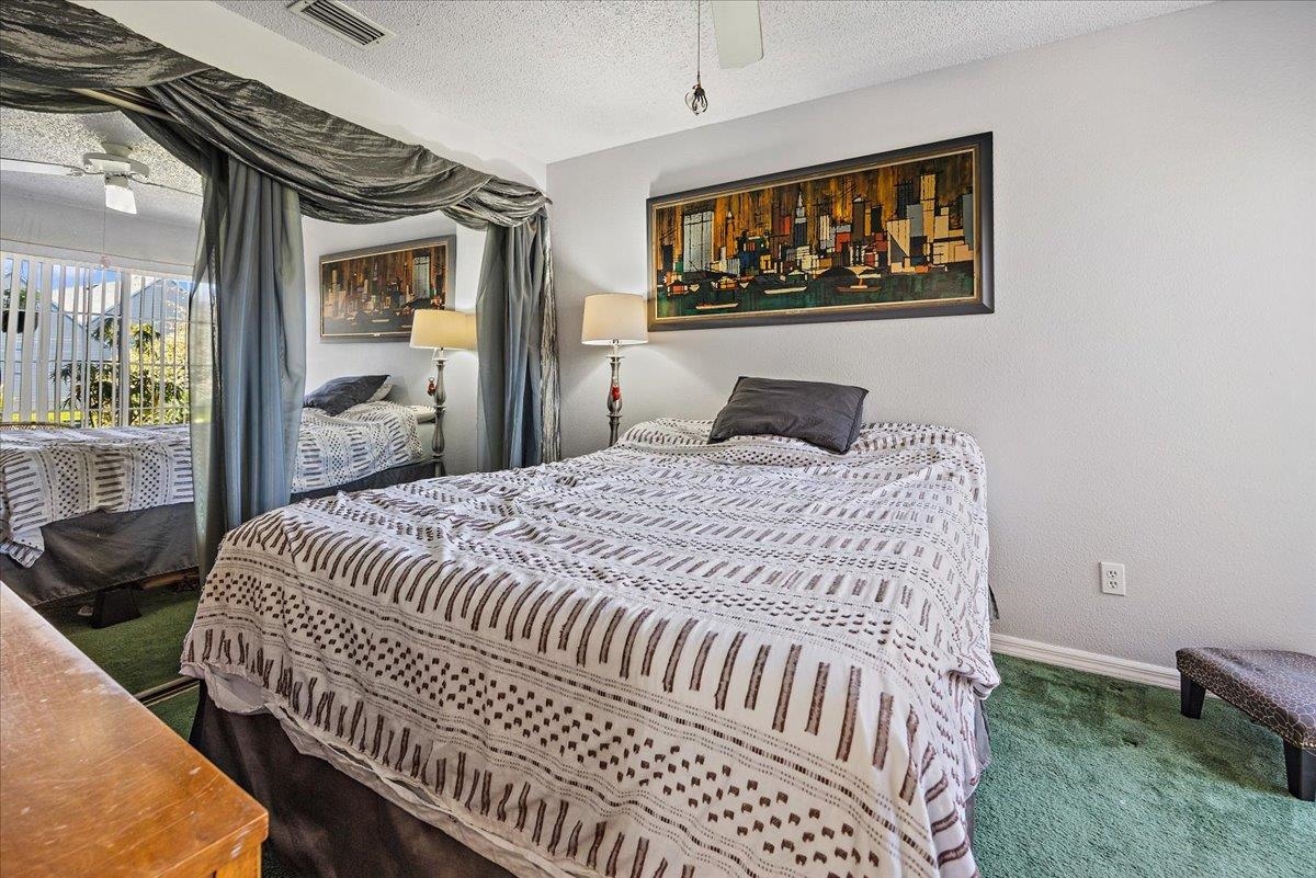 100 North Lake Circle St. Augustine, FL 32084 - Photo 12 of 25 a bedroom with a bed and a window