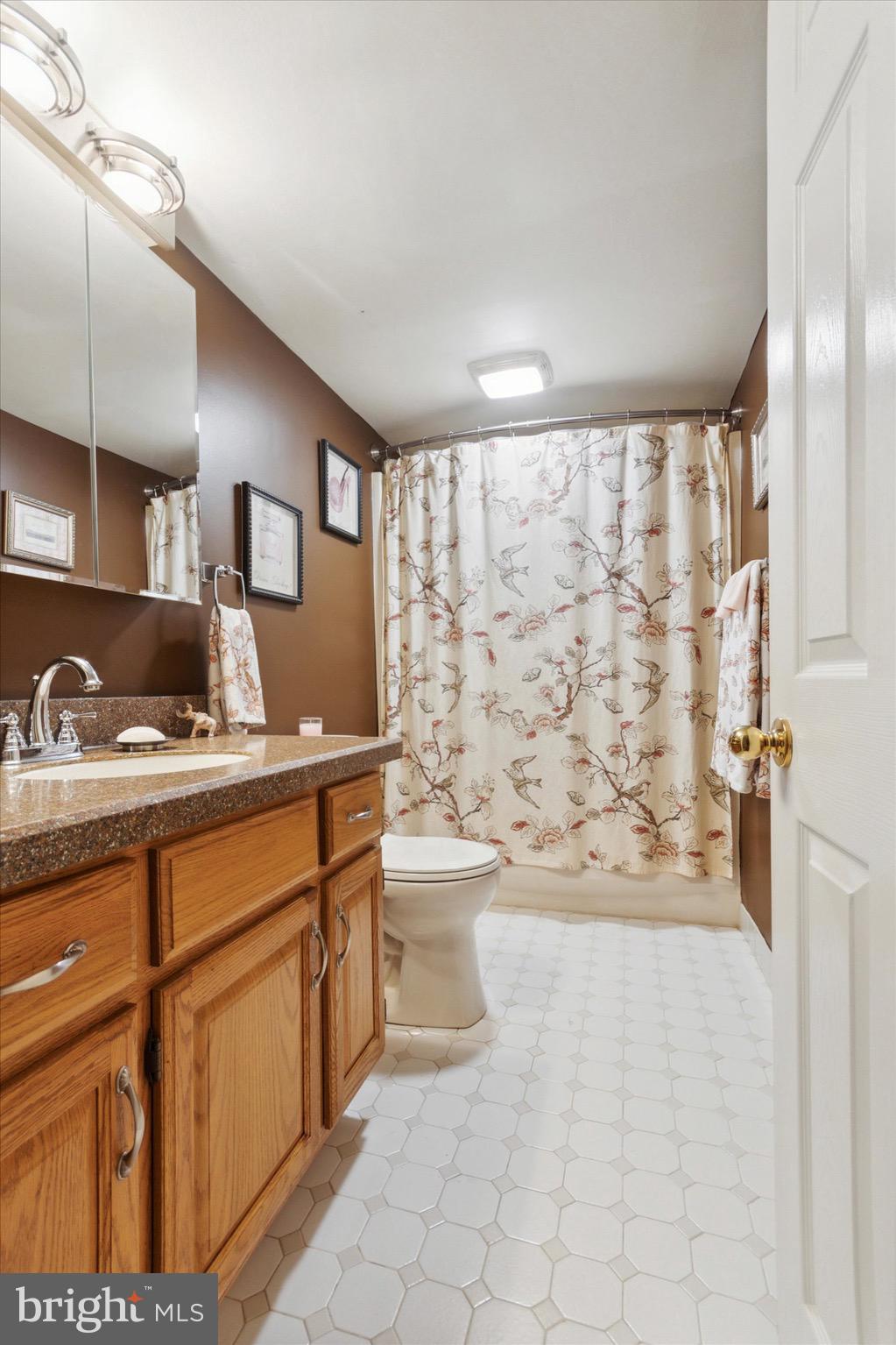 800 Avondale Road, Unit 5L Wallingford, PA 19086 - Photo 18 of 25 a bathroom with a sink toilet and shower