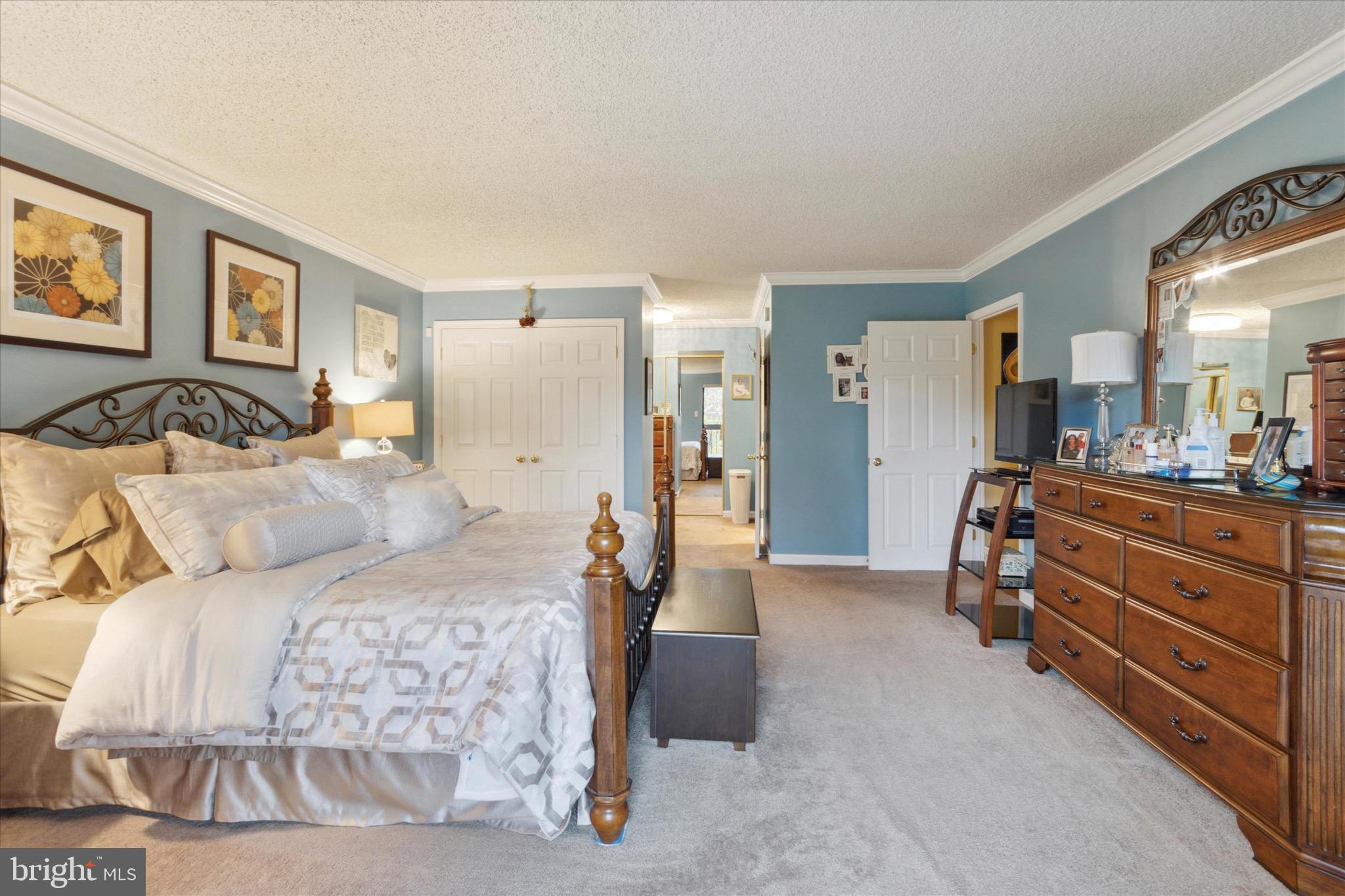 800 Avondale Road, Unit 5L Wallingford, PA 19086 - Photo 22 of 25 a bedroom with a bed and a mirror