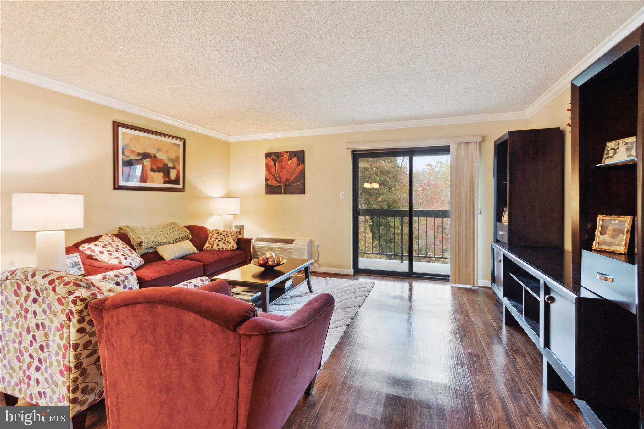 800 Avondale Road, Unit 5L Wallingford, PA 19086 - Photo 3 of 25 a living room with furniture and a flat screen tv
