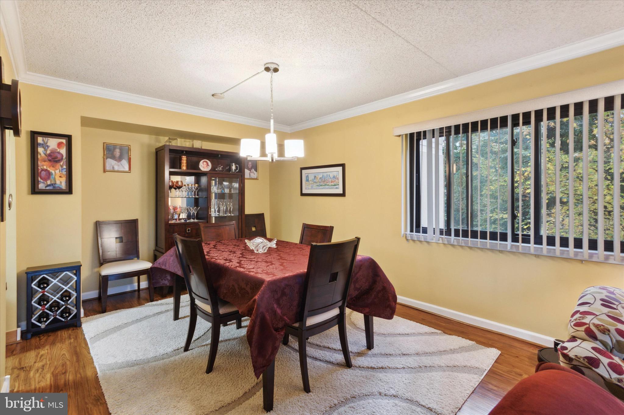 800 Avondale Road, Unit 5L Wallingford, PA 19086 - Photo 5 of 25 a view of a dining room with furniture