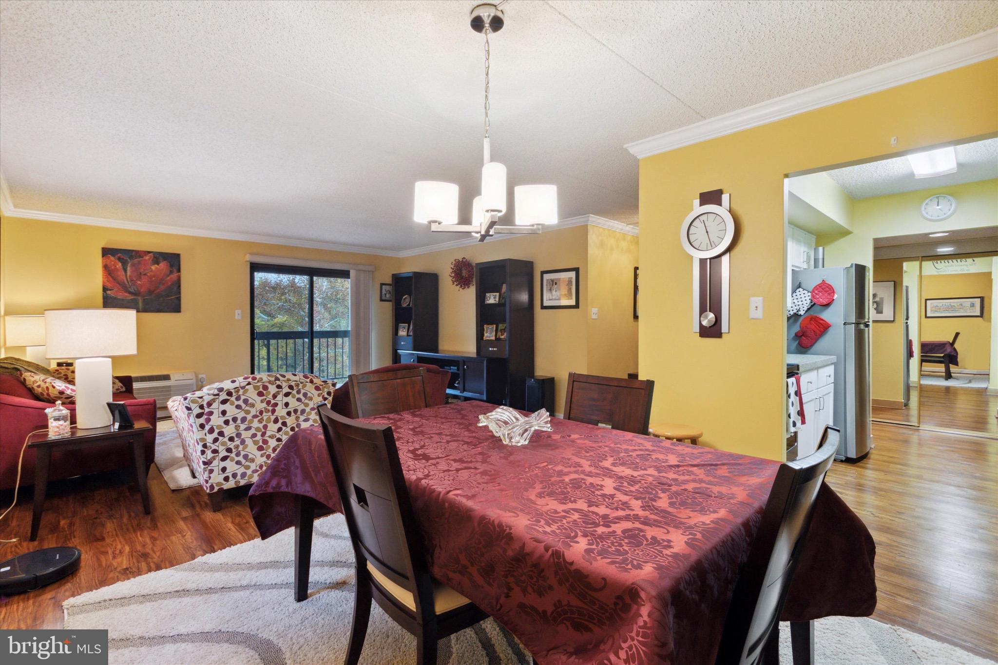 800 Avondale Road, Unit 5L Wallingford, PA 19086 - Photo 6 of 25 a view of a dining room with furniture and wooden floor