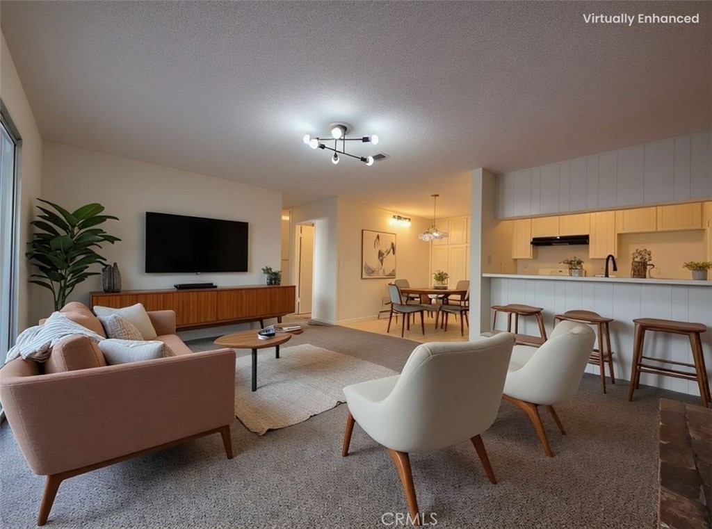 850 Vallejo Avenue Simi Valley, CA 93065 - Photo 11 of 50 a living room with furniture and a flat screen tv