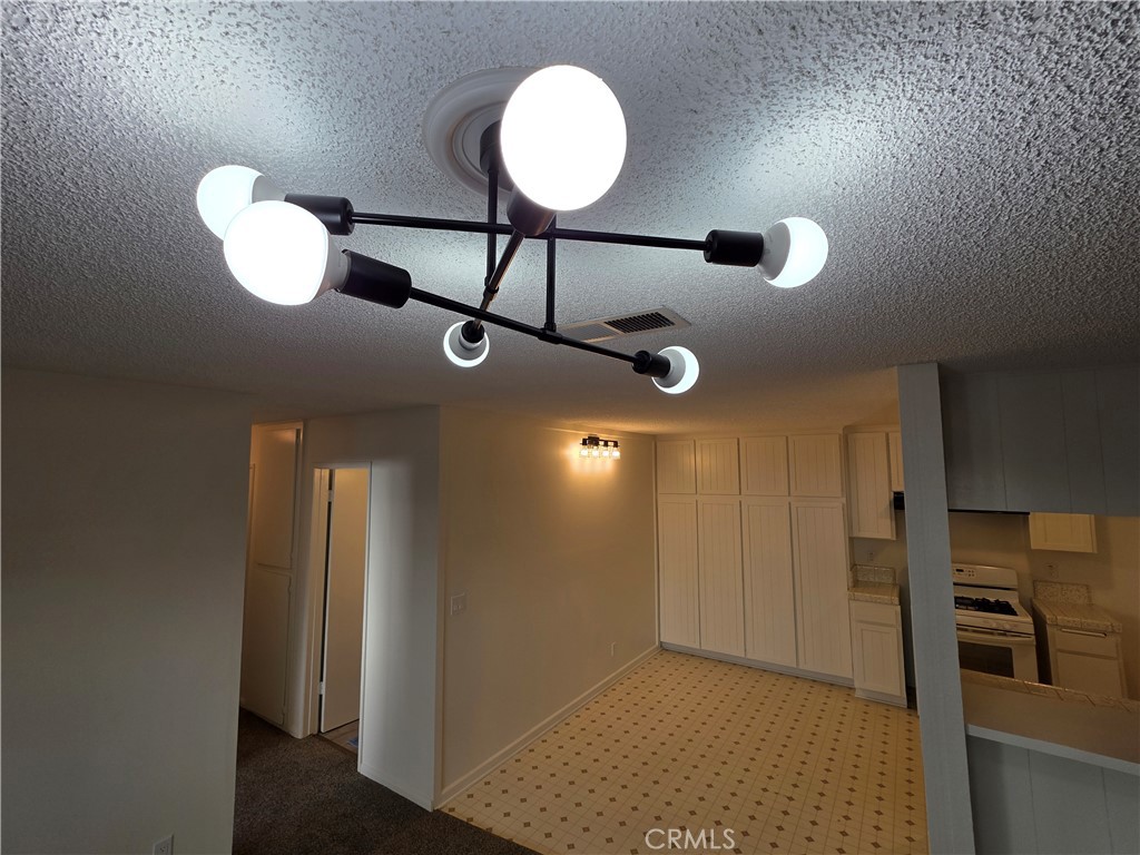 850 Vallejo Avenue Simi Valley, CA 93065 - Photo 14 of 50 a view of a room with a chandelier fan and windows