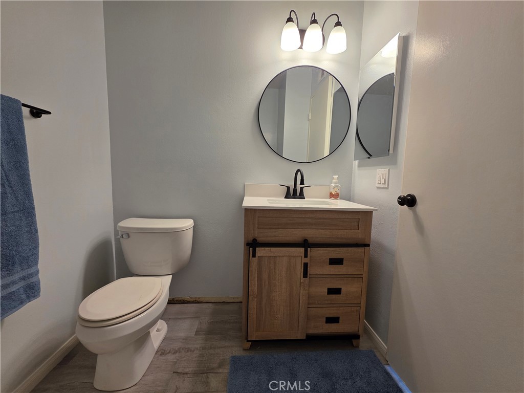 850 Vallejo Avenue Simi Valley, CA 93065 - Photo 25 of 50 a bathroom with a sink a toilet and a mirror