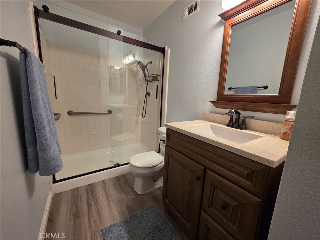 850 Vallejo Avenue Simi Valley, CA 93065 - Photo 28 of 50 a bathroom with a sink a toilet a mirror and shower