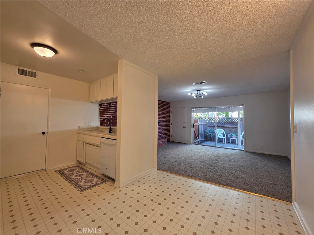 850 Vallejo Avenue Simi Valley, CA 93065 - Photo 5 of 50 a view of a hallway with a dining table