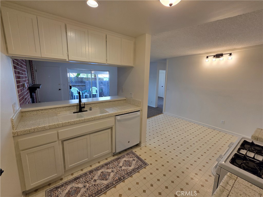850 Vallejo Avenue Simi Valley, CA 93065 - Photo 9 of 50 a bathroom with a sink a toilet and a mirror