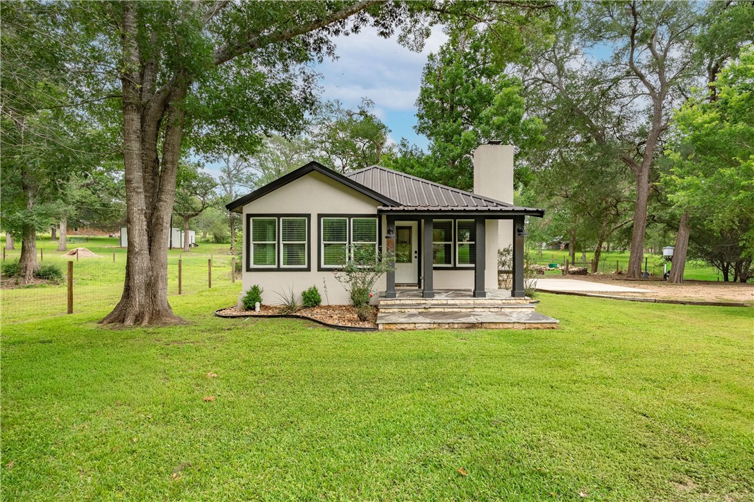 2283 Tigerpoint Road Brenham, TX 77833 - Photo 1 of 27 a front view of a house with a yard and trees