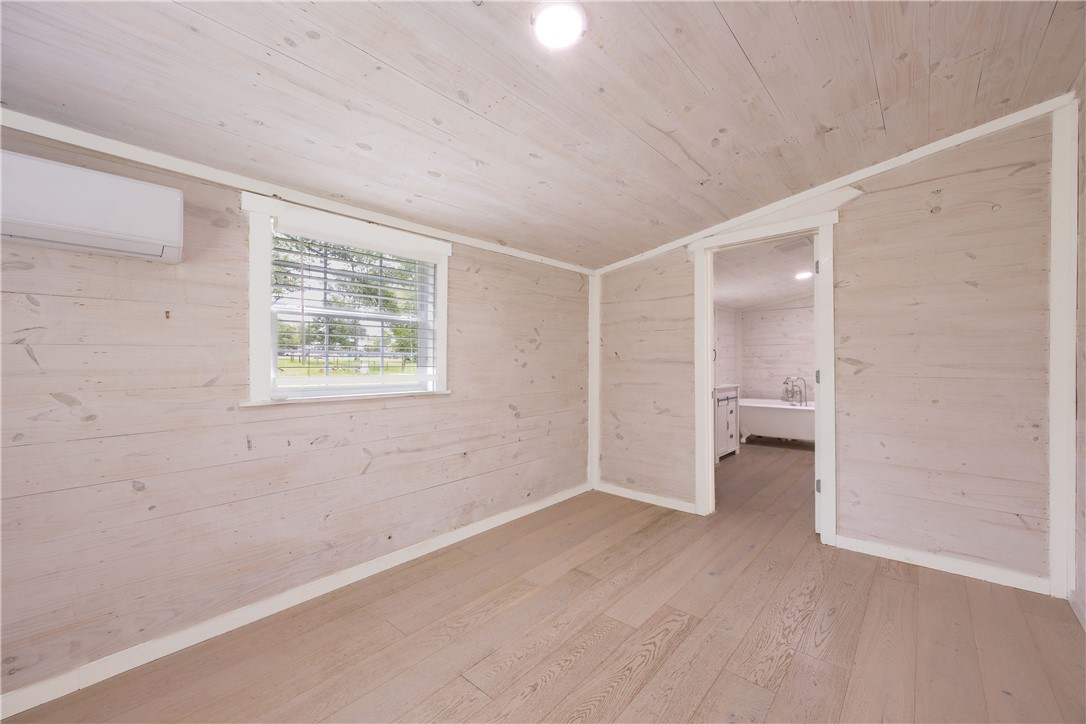 2283 Tigerpoint Road Brenham, TX 77833 - Photo 21 of 27 an empty room with a windows and closet