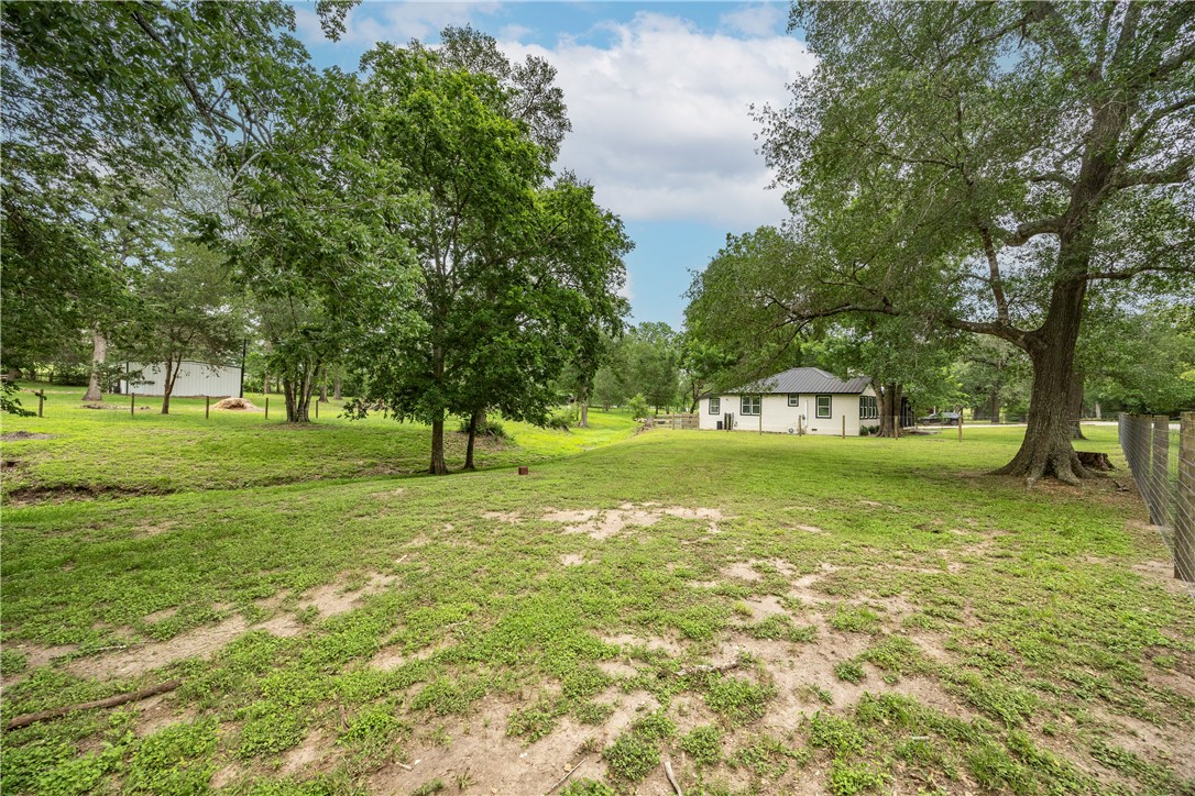 2283 Tigerpoint Road Brenham, TX 77833 - Photo 25 of 27 a view of a trees in front of a house