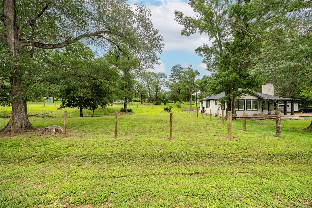 2283 Tigerpoint Road Brenham, TX 77833 - Photo 26 of 27 a huge green field with lots of trees