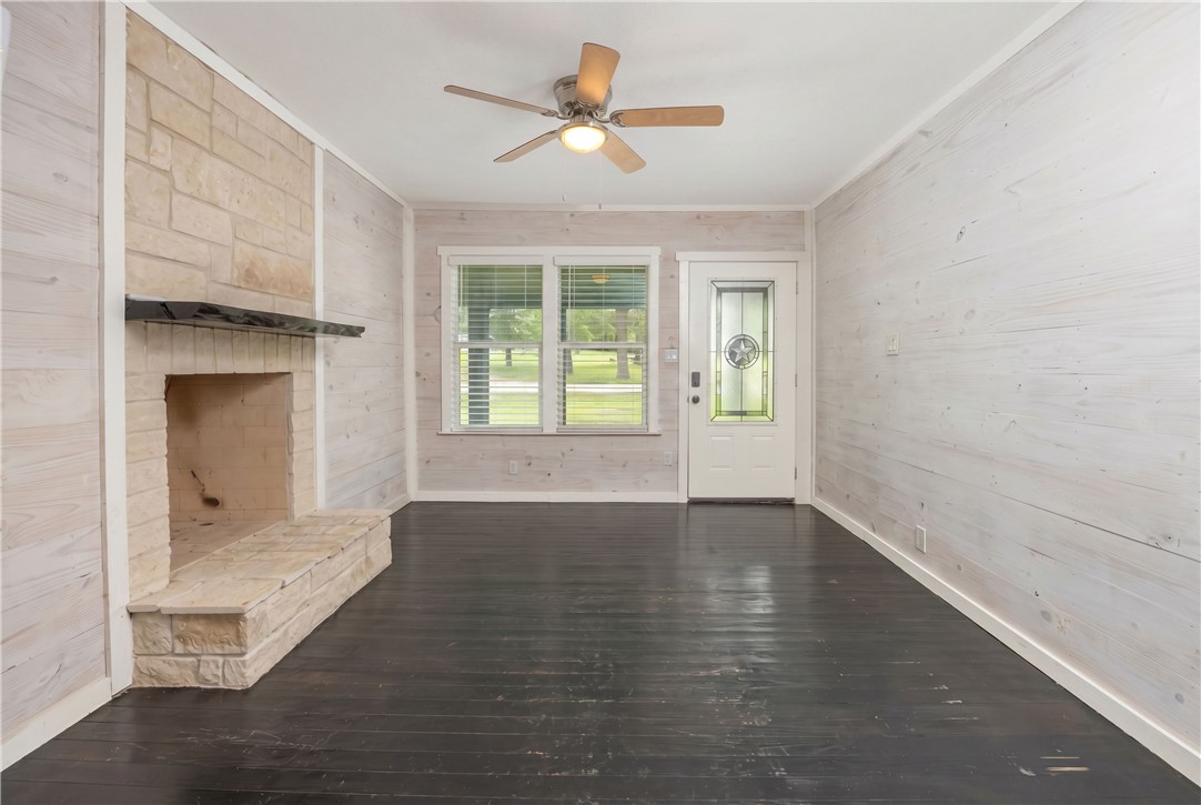 2283 Tigerpoint Road Brenham, TX 77833 - Photo 3 of 27 wooden floor in an empty room with a window