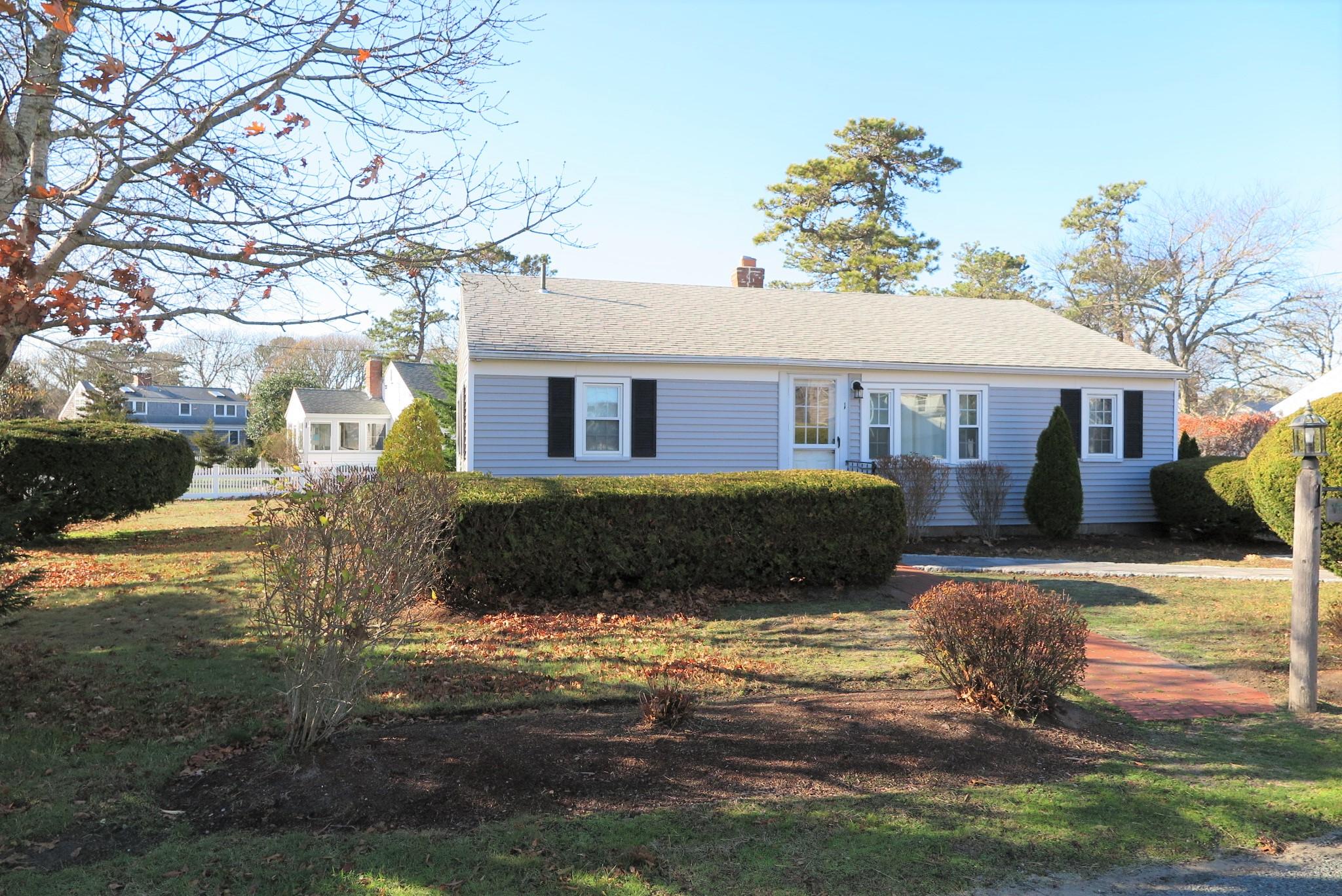 1 Hamilton Road Dennis Port, MA 02639 - Photo 1 of 29 a view of a house with a yard
