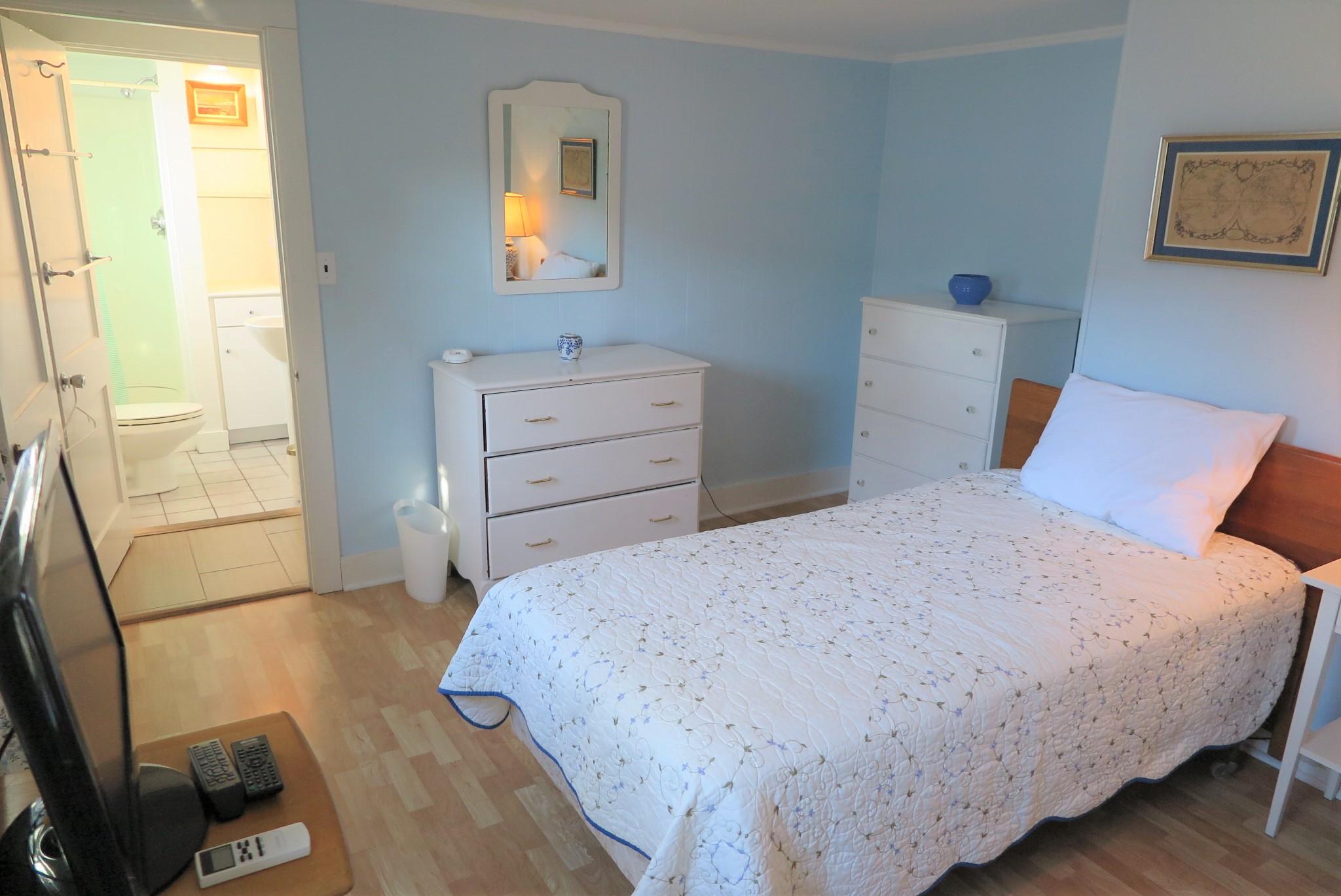 1 Hamilton Road Dennis Port, MA 02639 - Photo 20 of 29 a bedroom with a bed and wooden floor